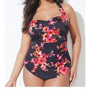One piece sarong black floral baiting suit.  Never worn